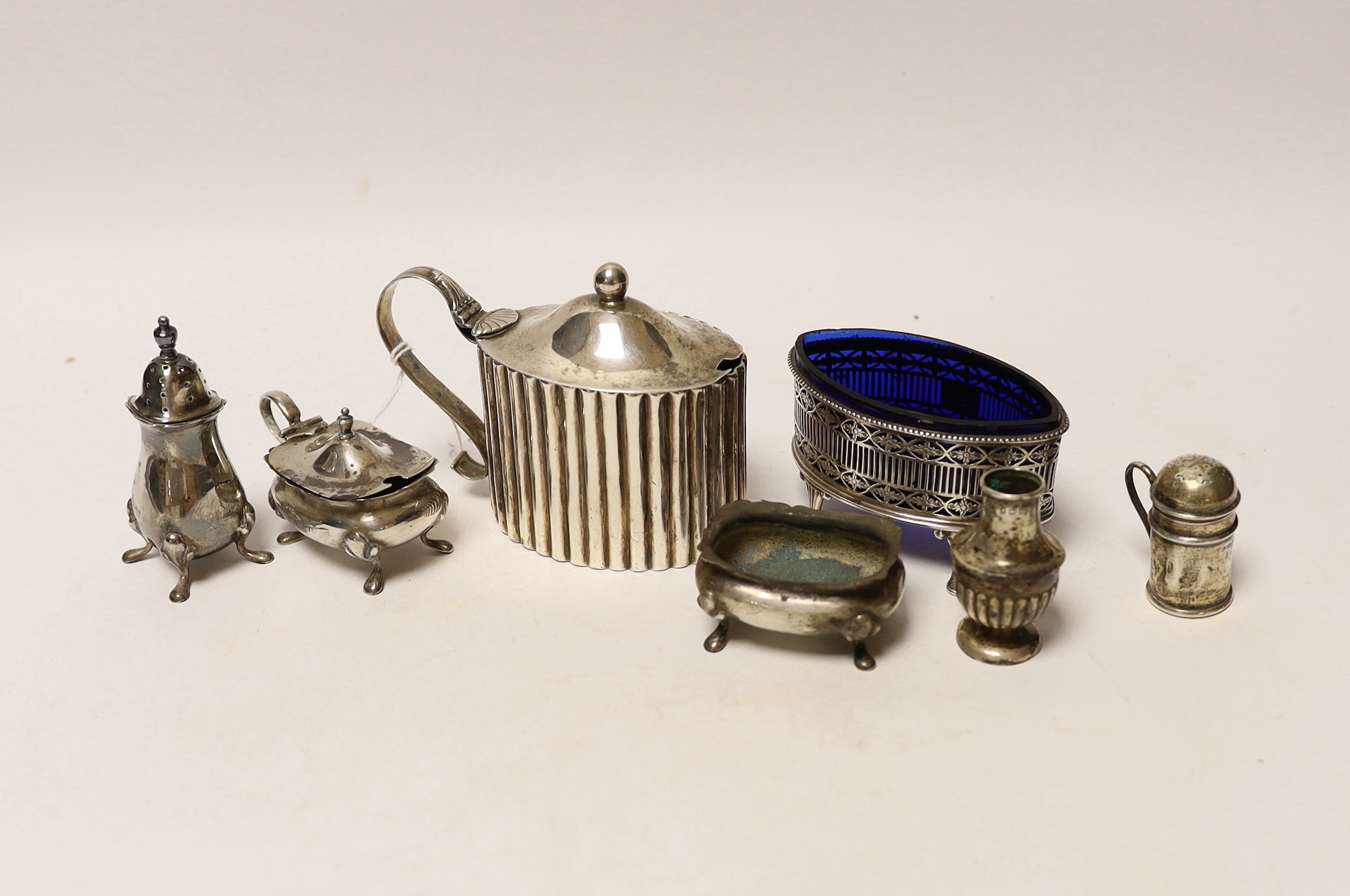 A George III silver mustard, by Peter & Jonathan Bateman, London, 1790 and six other minor silver condiments.